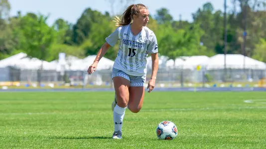 Marissa House looks to pass the ball