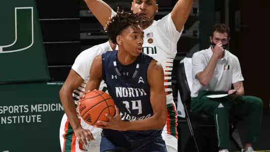 Jadyn Parker dribbles the ball in the lane against a defender