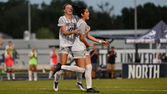 Thais Reiss celebrates her scoring a goal with Kendra Hoffman