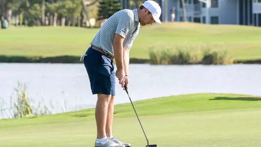Brandon Mancheno putts a ball on the green