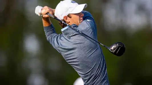 Nick Gabrelcik watches ball after swinging his driver
