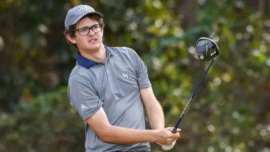 Cody Carroll swings a golf club