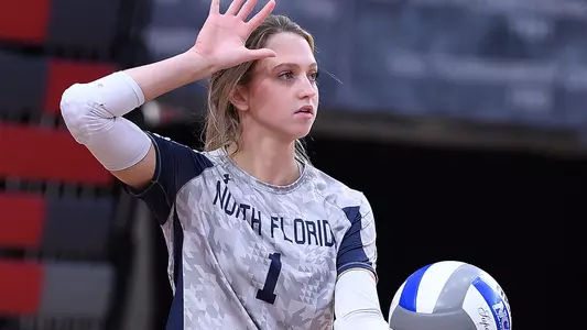 Logan O'Brien serving the ball