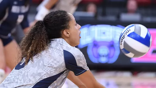 Gabby O'Connell digs a ball