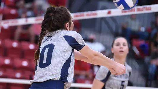 Grace Youngblood digs a ball.