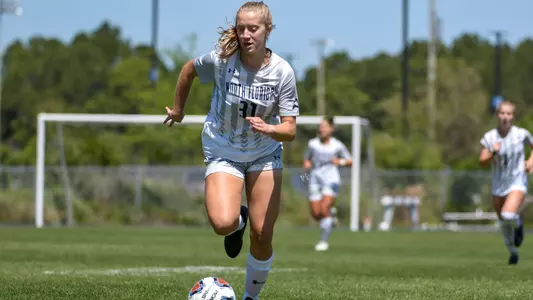 Vanessa Piermont dribbles the ball down the field