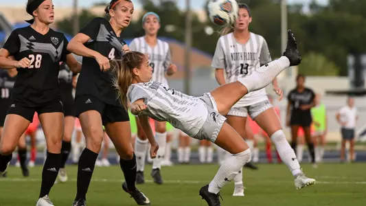 Carmel Oliveira attempts a bicycle kick in a match