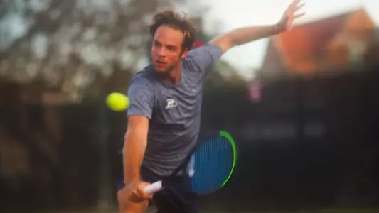 nilo hitting a backhand volley