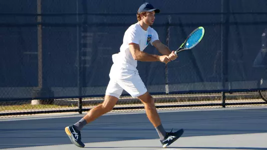 Nilo hitting a backhand