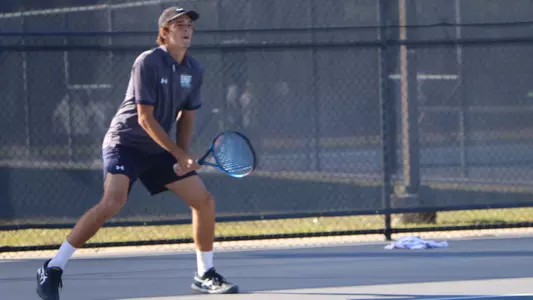 pj getting ready to return a serve
