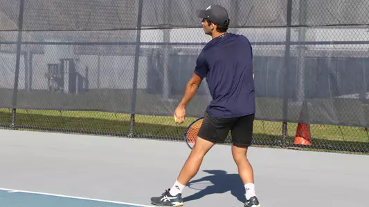 Breno getting ready to toss the ball to serve