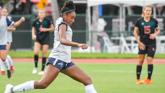 Allyna Thurston kicking the ball at Miami