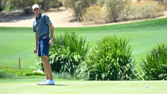 Nick Gabrelcik watching putt on golf course