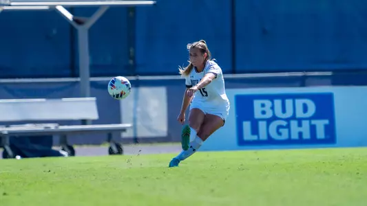 Marissa House kicking the ball