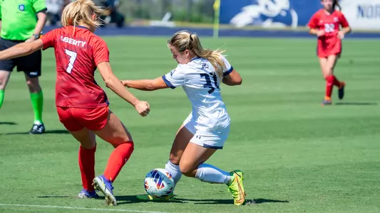 Allie Fekany dribbling the ball forward