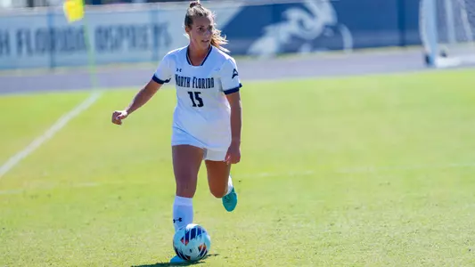 Marissa House dribbling up field