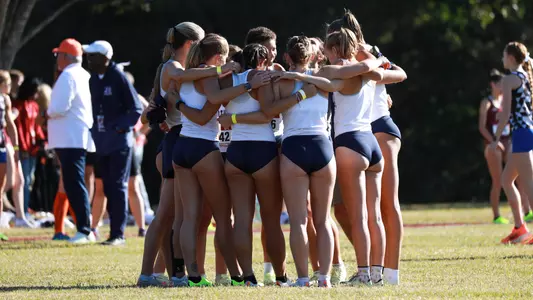 Women's cross country team huddle