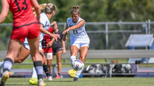 Chloe Lynch kicking the ball