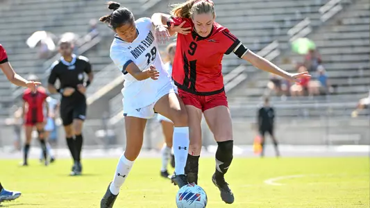 Kalliyan Pho going for the ball