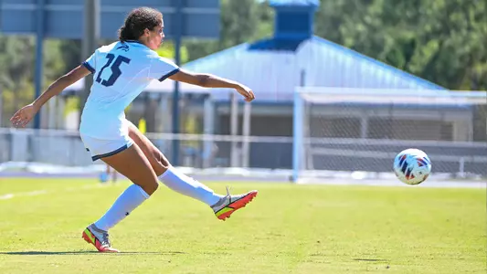 Brenna Robinson kicking the ball