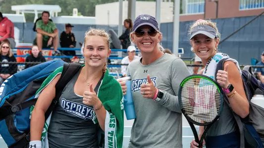 Jasmin Makela, Catherine Dunagan and Kendall Nash smiling after a win