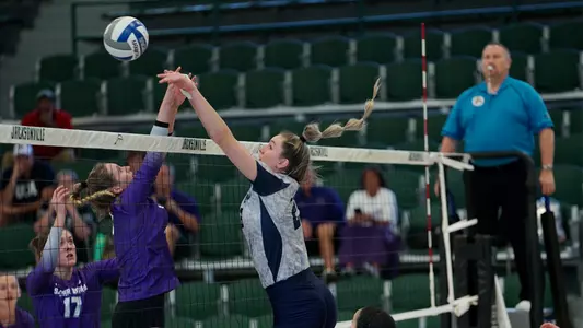 Kierstyn McFall going up for a block