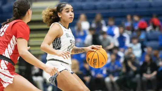 Lyric Swann dribbling against Marist in Ireland