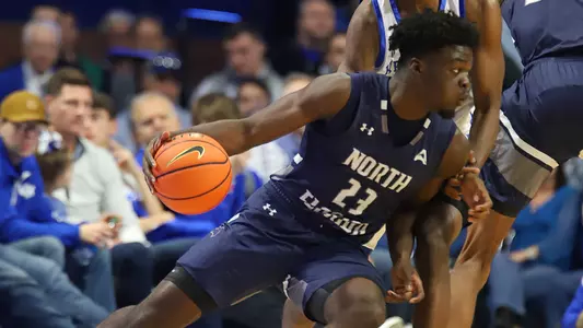 Jah Nze driving to the hoop