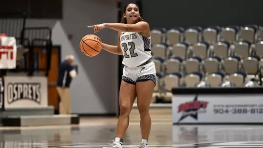 Lyric Swann directing on the court