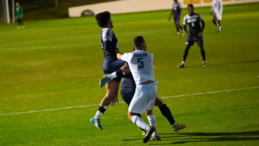 Joaquin Acuna jumping for ball against FGCU