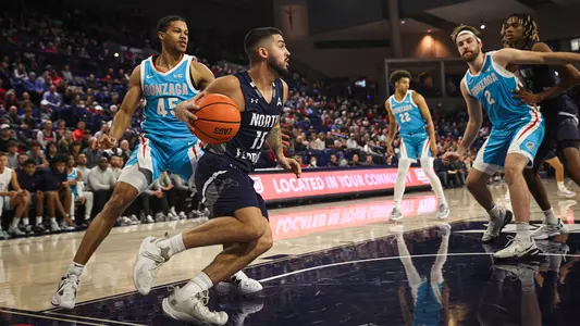 Jose Placer driving to the hoop