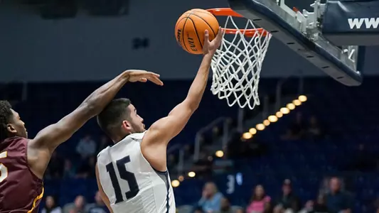 Jose Placer shooting a three-pointer at Bethune-Cookman