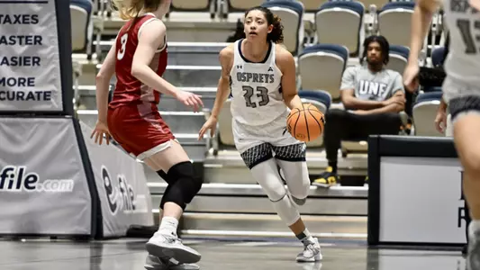 Jae Swann taking ball down court