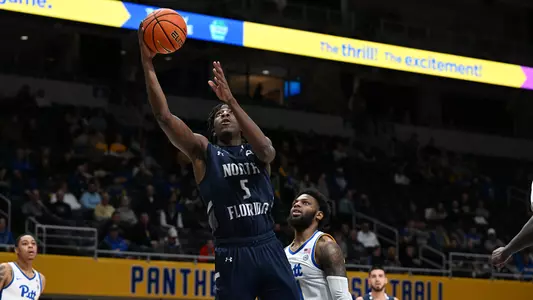 Dorian James driving to the hoop
