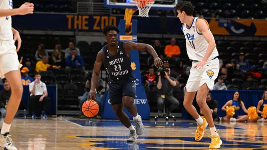 Jah Nze bringing the ball up the court