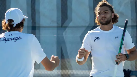 PJ Kotan and Rodrigo Crepso give a fist bump