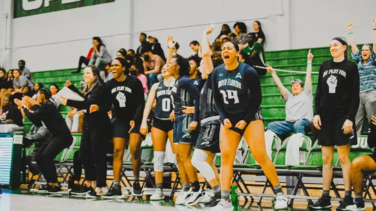 UNF women's basketball celebrating win at JU