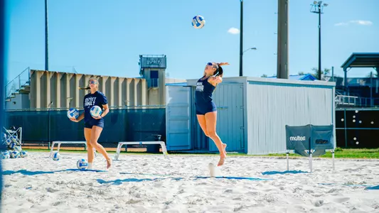 Madeline Camp serving the ball