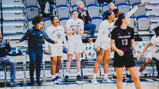 UNF WBB celebrating a win against Bellarmine