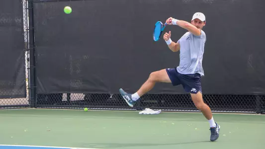 Joe Ellis hitting a forehand