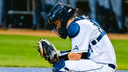 Dallen Leach behind home plate.