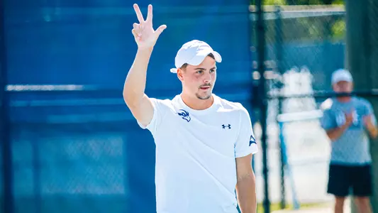 Dominik Barton raising his hand.