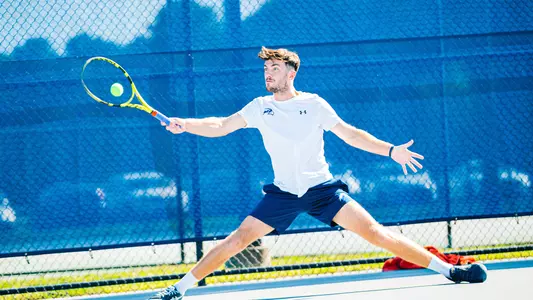 Matt Carroll hitting a forehand.