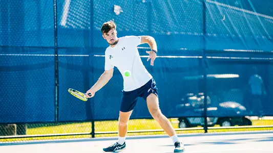 Matt Carroll hitting a forehand.