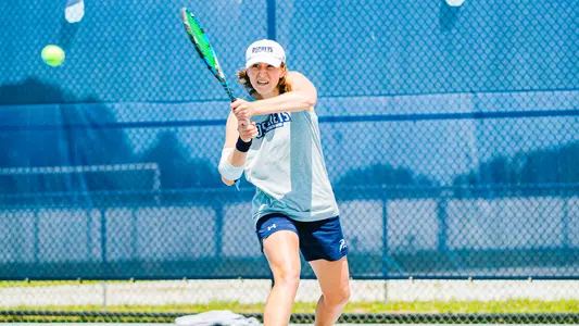 Kit Guliher hitting a backhand.