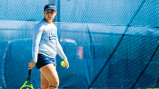 Ana Paula Melilo preparing to serve.