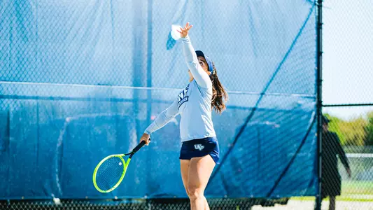 Ana Paula Melilo about to serve.