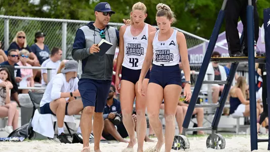 Taryn Griffey and Callie talking to head coach Doug Wright