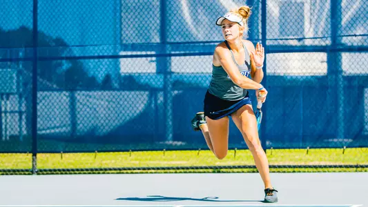 Anslee Long following through on a forehand