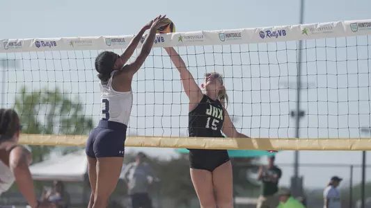 Gabby O'Connell stuffing an attack at the net